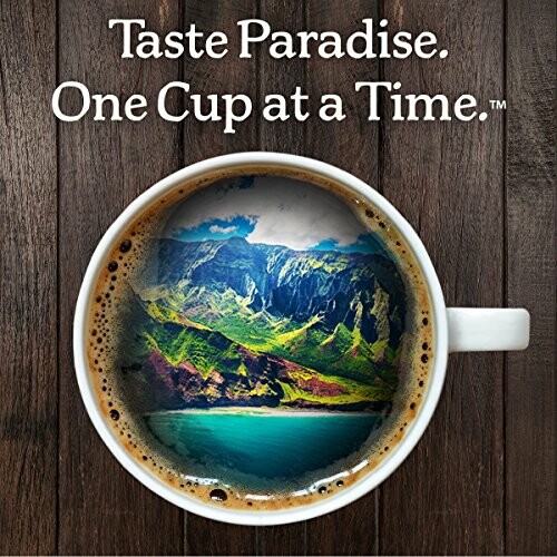 Coffee cup with island landscape inside and text 'Taste Paradise. One Cup at a Time.'