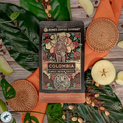 Bones Coffee Company Colombian single origin coffee package surrounded by leaves, apples, and coffee beans