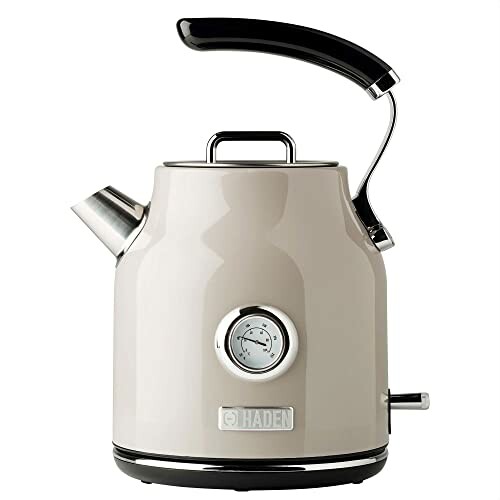 Cream electric kettle with temperature gauge and black handle