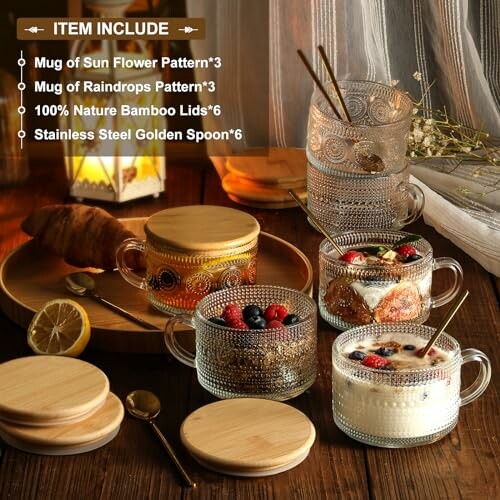 Assorted glass mugs with bamboo lids and golden spoons on a wooden table.