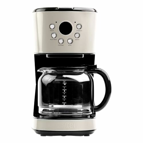 Modern coffee maker with glass carafe and control buttons.