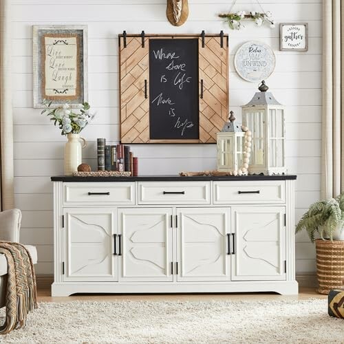 Rustic living room decor with white sideboard, chalkboard, books, and lanterns.