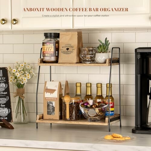 A wooden coffee bar organizer with coffee supplies and decor on a countertop.