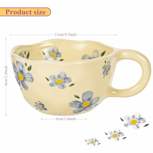 Yellow mug with blue flower design and handle